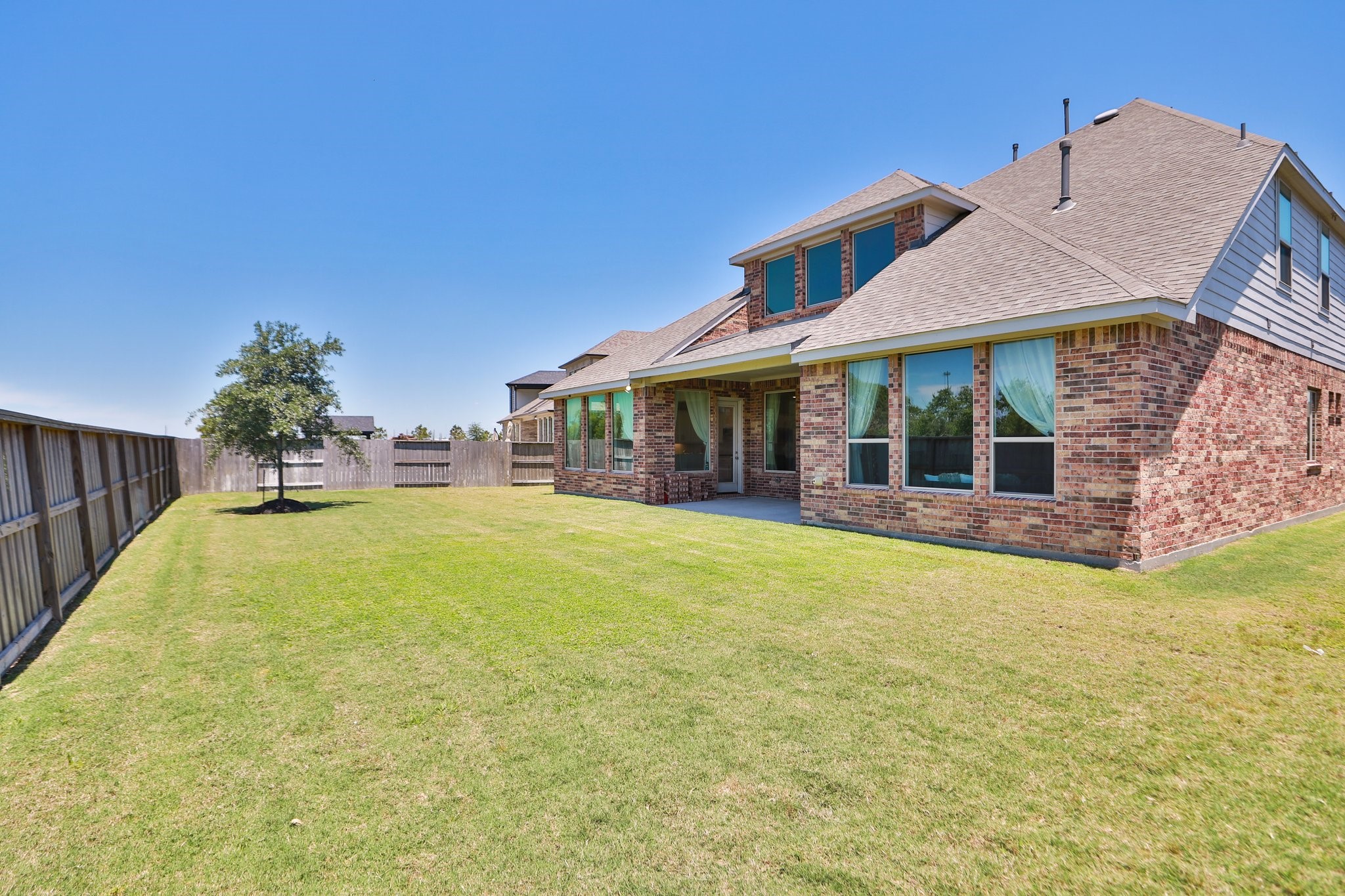 10134 Blythe Street Rosharon, TX 77583 - Photo 49 of 50 a view of a house with swimming pool and porch