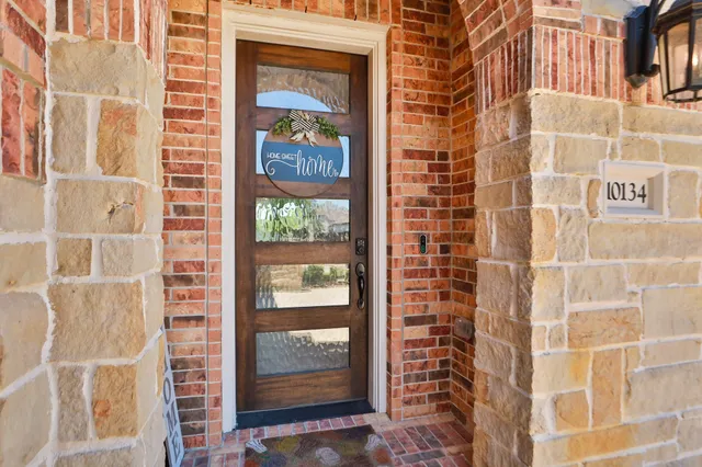 a view of a workspace with furniture and a potted plant