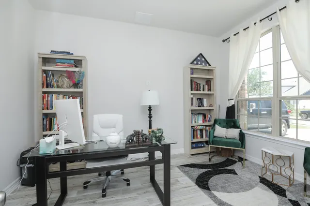 a bedroom with a bed and a television