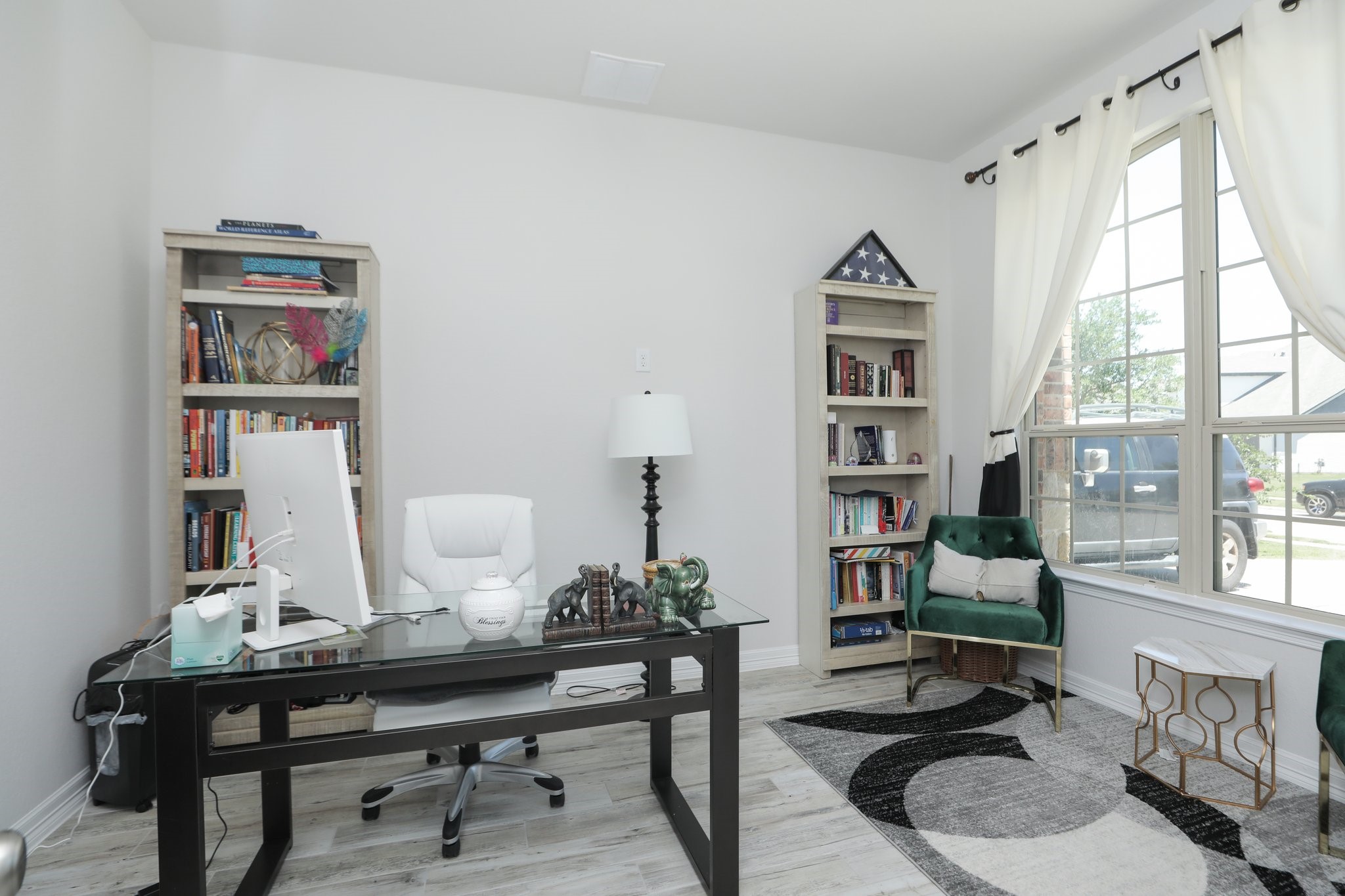 10134 Blythe Street Rosharon, TX 77583 - Photo 8 of 50 a view of a workspace with furniture and a potted plant