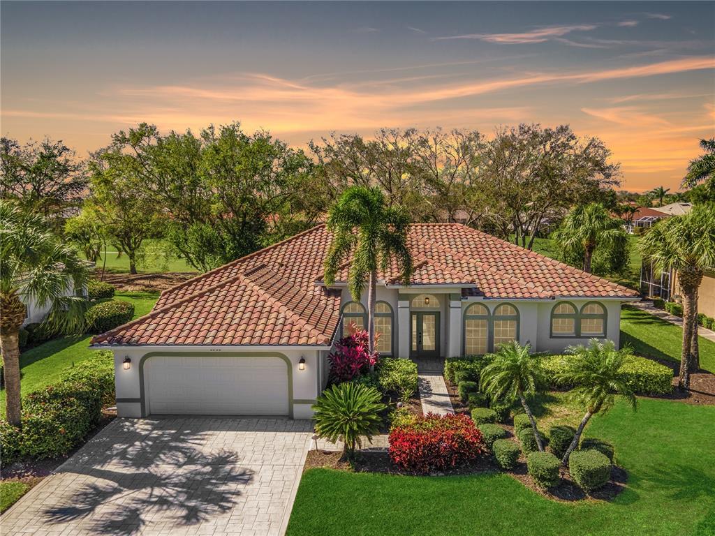 8900 Lely Island Circle Naples, FL 34113 - Photo 1 of 1 Sunset Front of Home