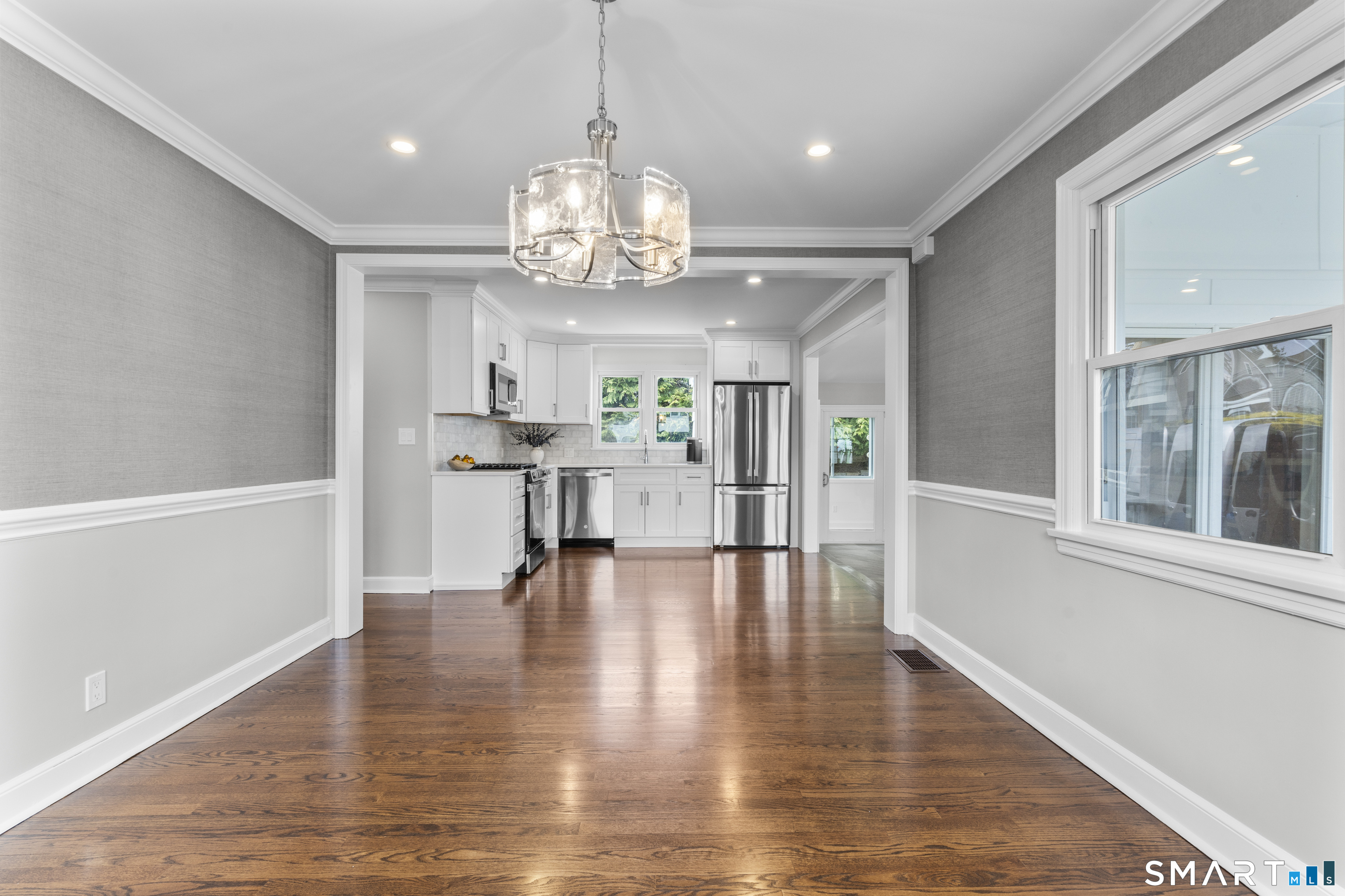 7 Fairview Avenue Trumbull, CT 06611 - Photo 5 of 19 a view of a room with wooden floor and large windows