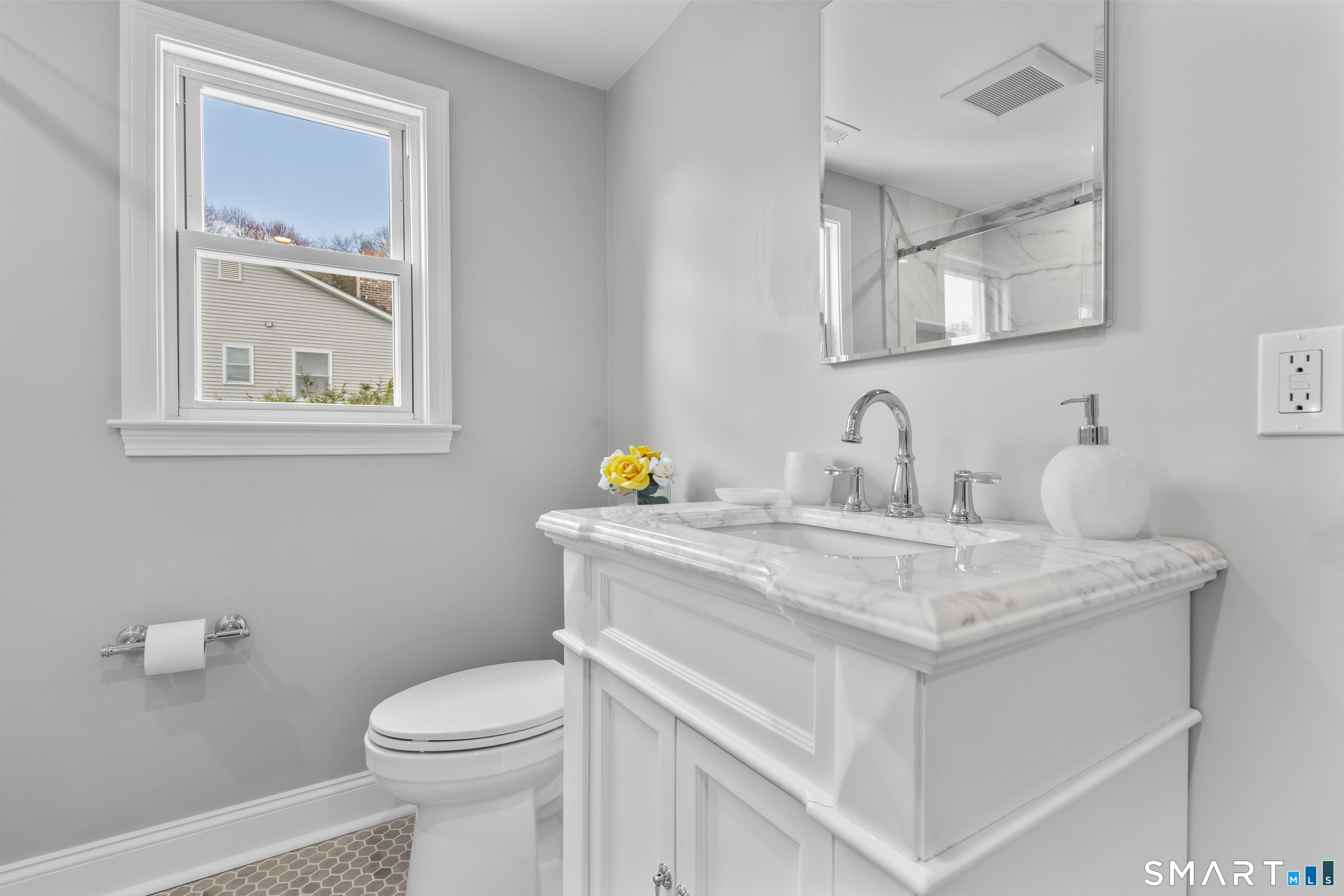 7 Fairview Avenue Trumbull, CT 06611 - Photo 6 of 19 a bathroom with a sink a toilet and mirror