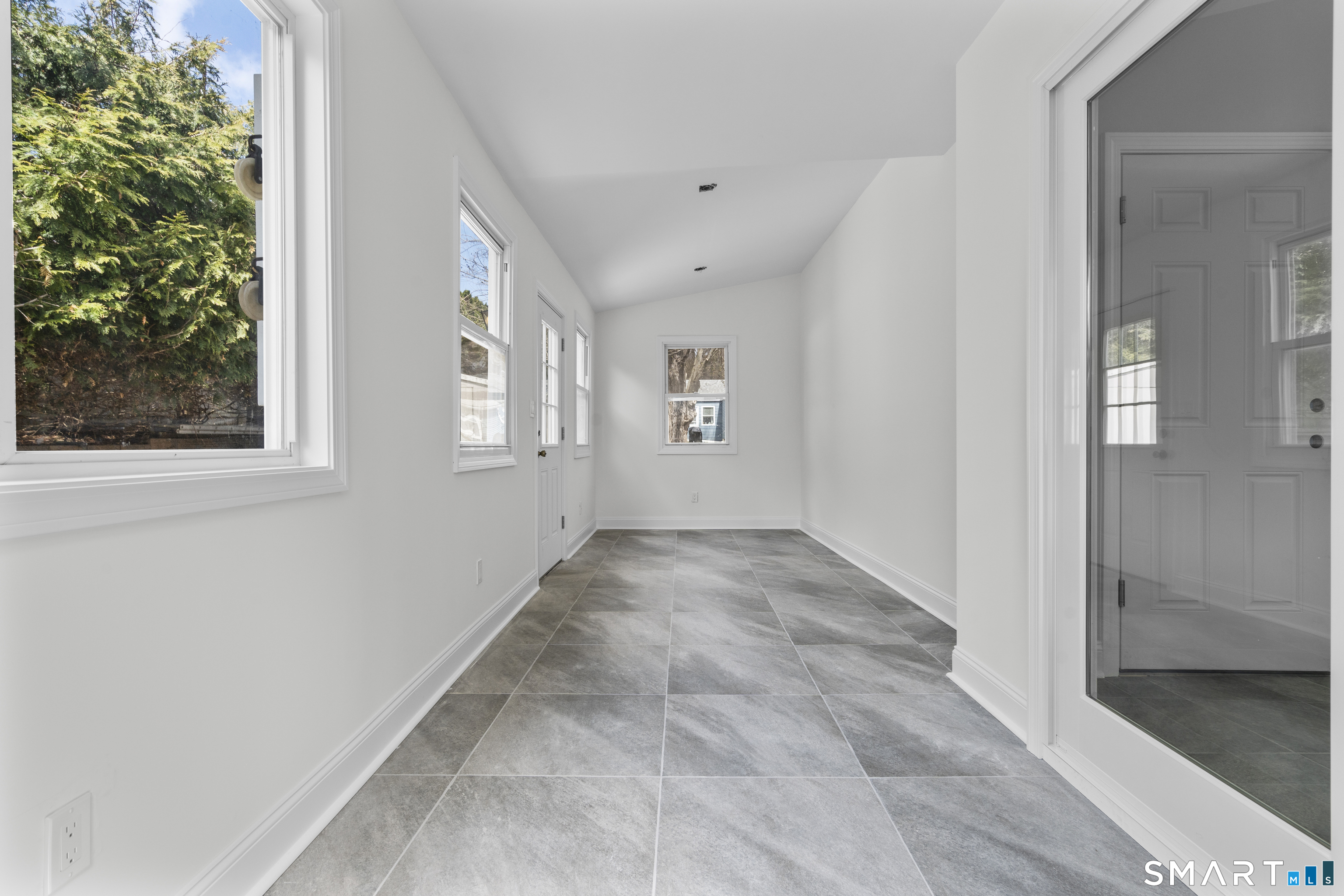 7 Fairview Avenue Trumbull, CT 06611 - Photo 9 of 19 a view of an empty room with windows