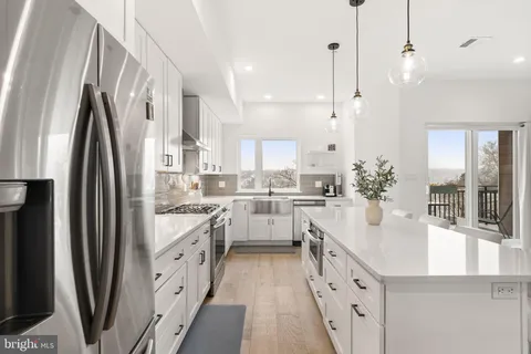 a view of a livingroom with furniture and staircase