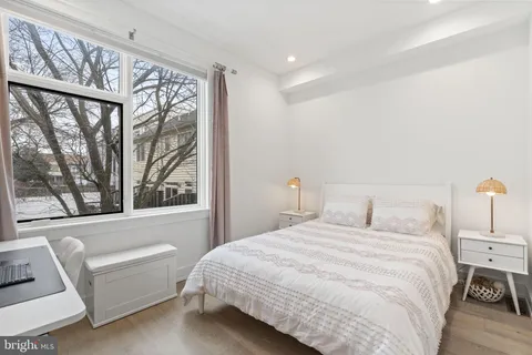 a view of walk in closet with clothes