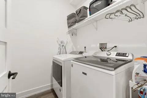 a bathroom with a shower and a sink