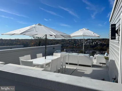 a view of a chairs and table on the terrace