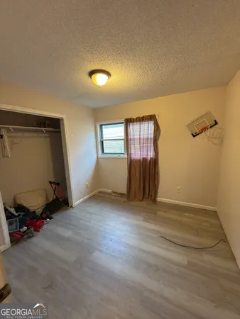a living room with a couch and wooden floor