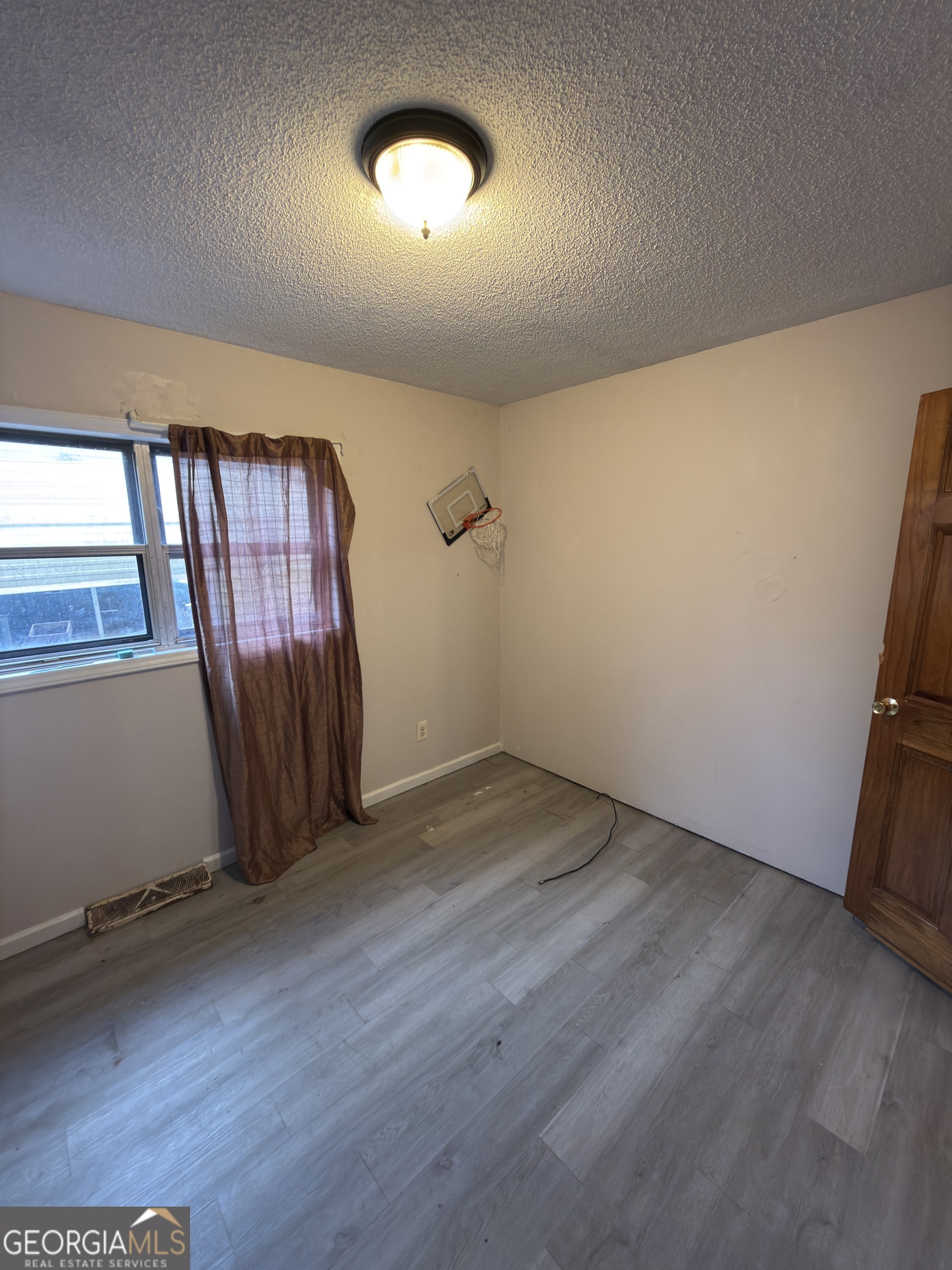 72 Ridgeview Court Lavonia, GA 30553 - Photo 24 of 47 an empty room with wooden floor and windows