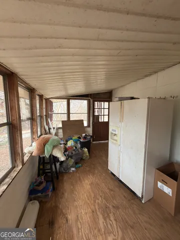 a view of a house with a yard and covered with snow
