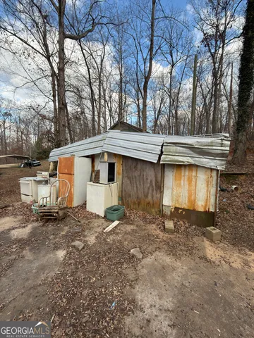 a bathroom with a toilet and shower