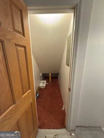 a view of a livingroom with furniture and a window