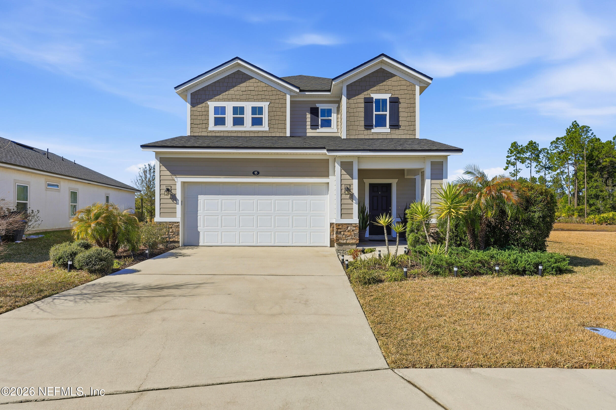 95 Strobe Court St. Augustine, FL 32095 - Photo 2 of 71 a front view of a house with a yard and garage