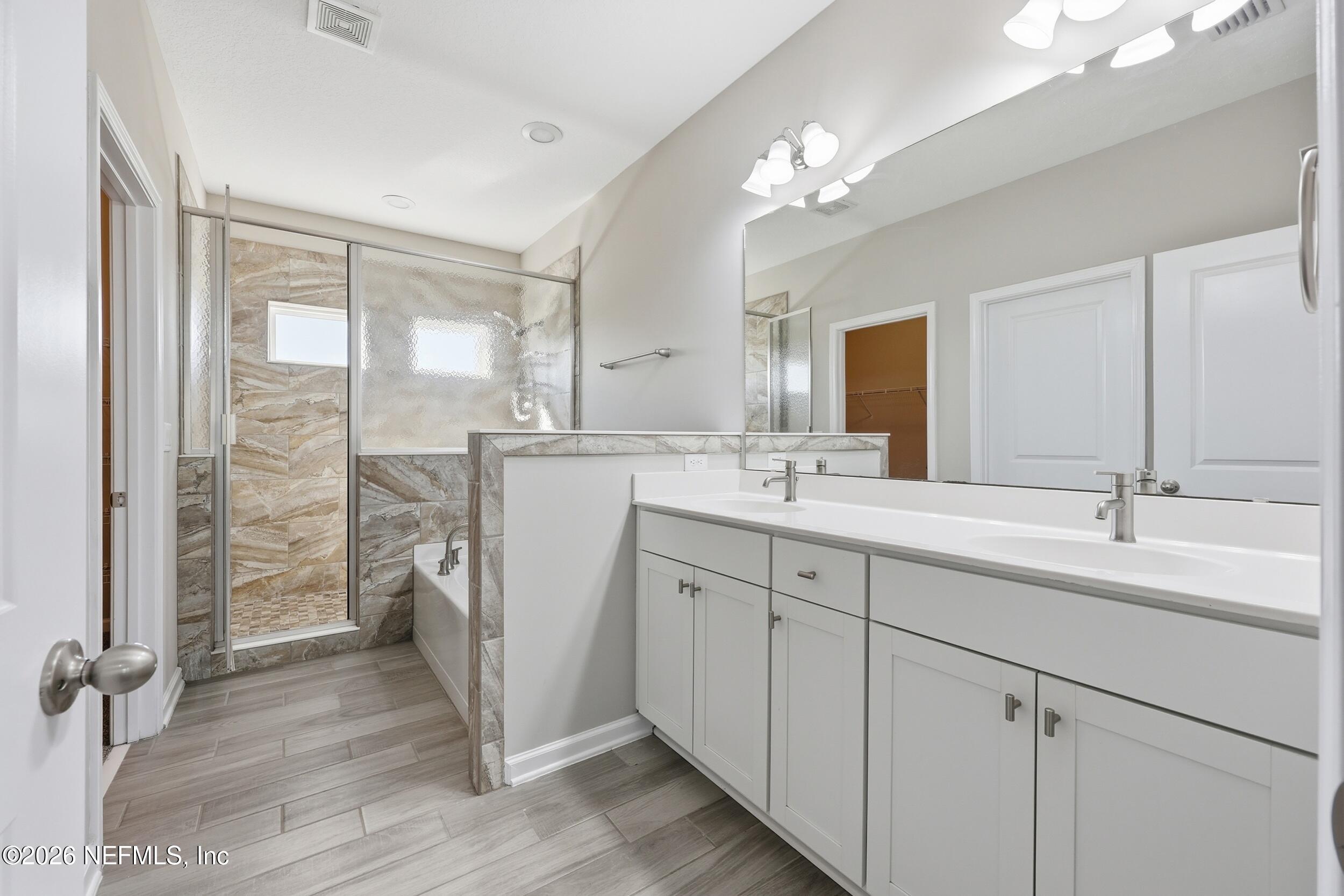 95 Strobe Court St. Augustine, FL 32095 - Photo 25 of 71 a bathroom with a double vanity sink mirror and double