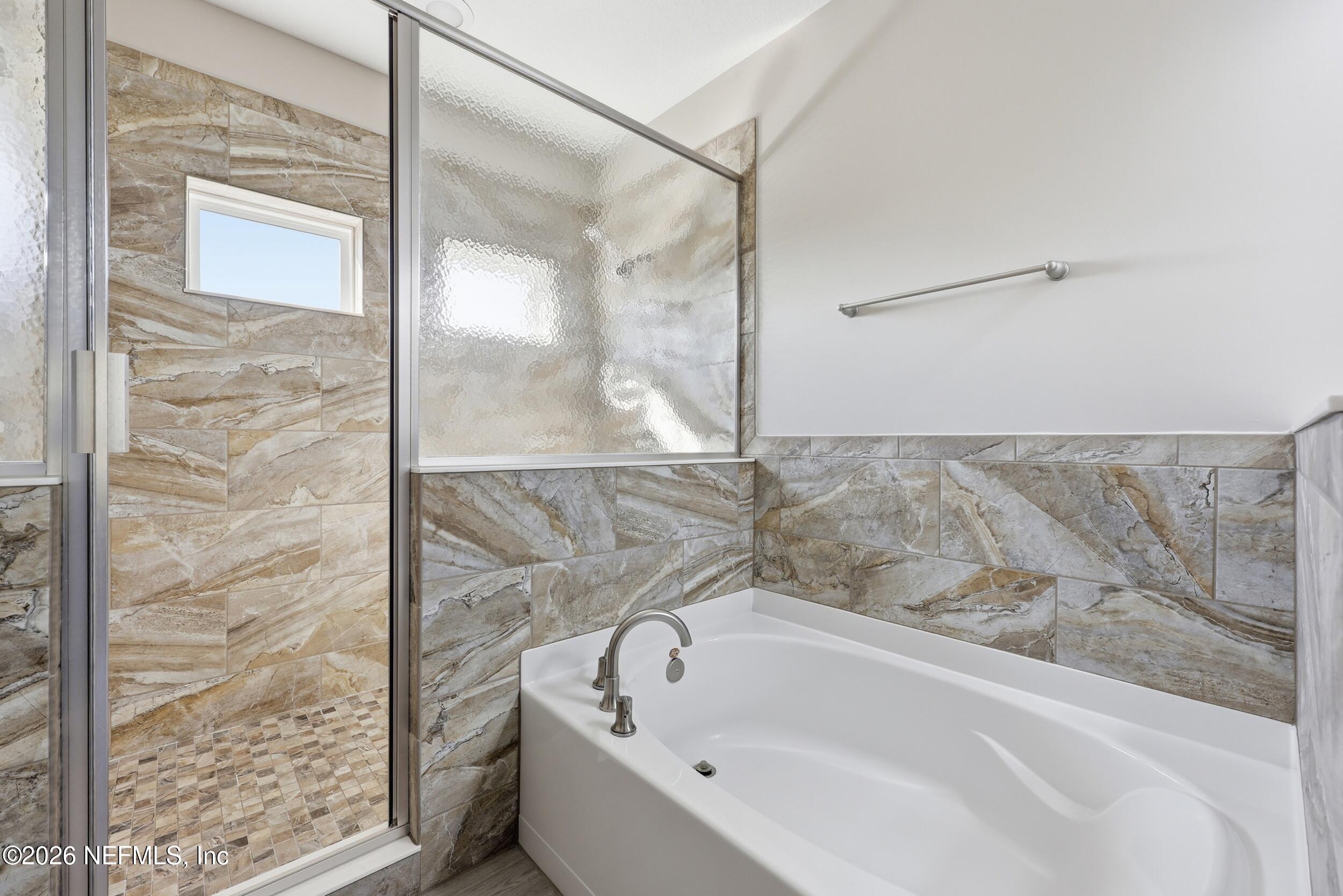 95 Strobe Court St. Augustine, FL 32095 - Photo 26 of 71 a bathroom with a bathtub and shower