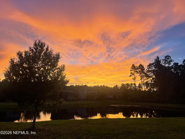 a view of swimming pool with outdoor seating