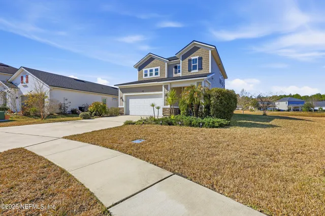 a living room with lots of furniture and flat screen tv