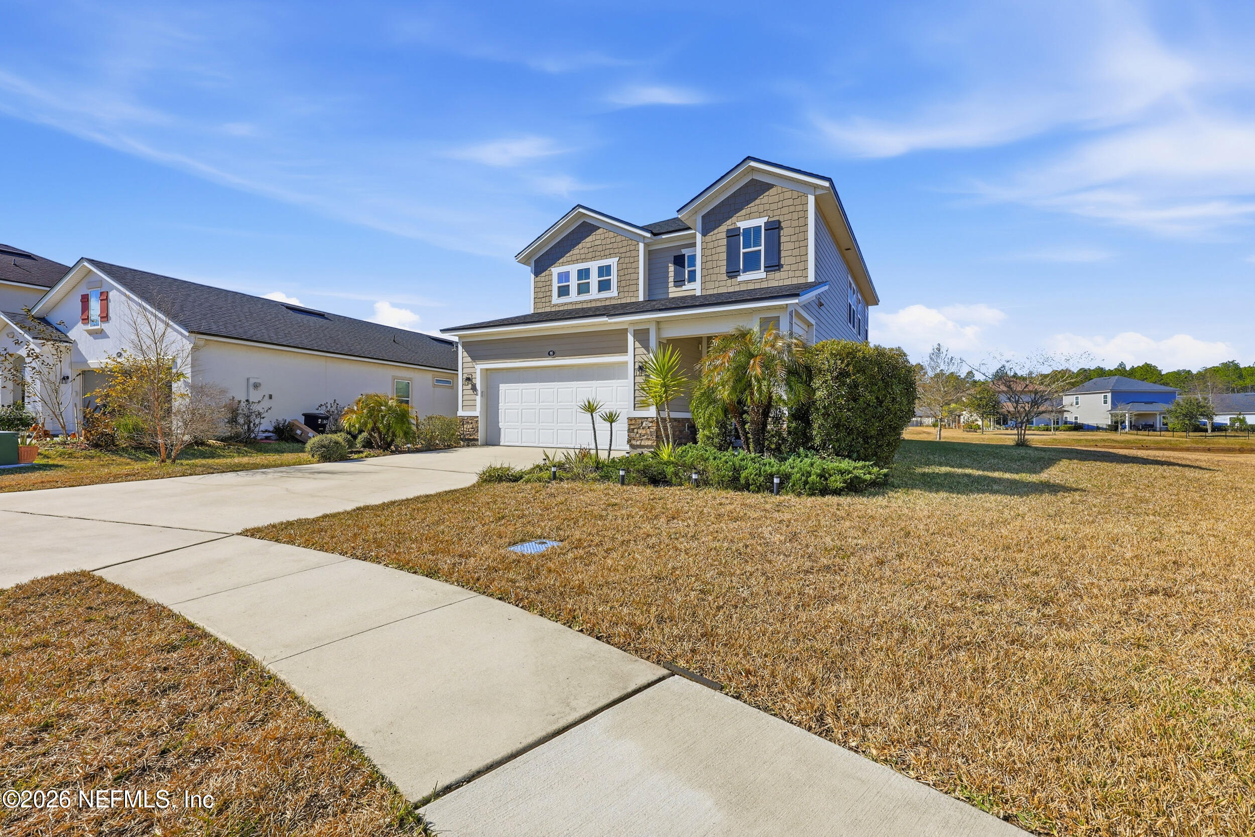 95 Strobe Court St. Augustine, FL 32095 - Photo 40 of 71 a front view of a house with a yard and garage