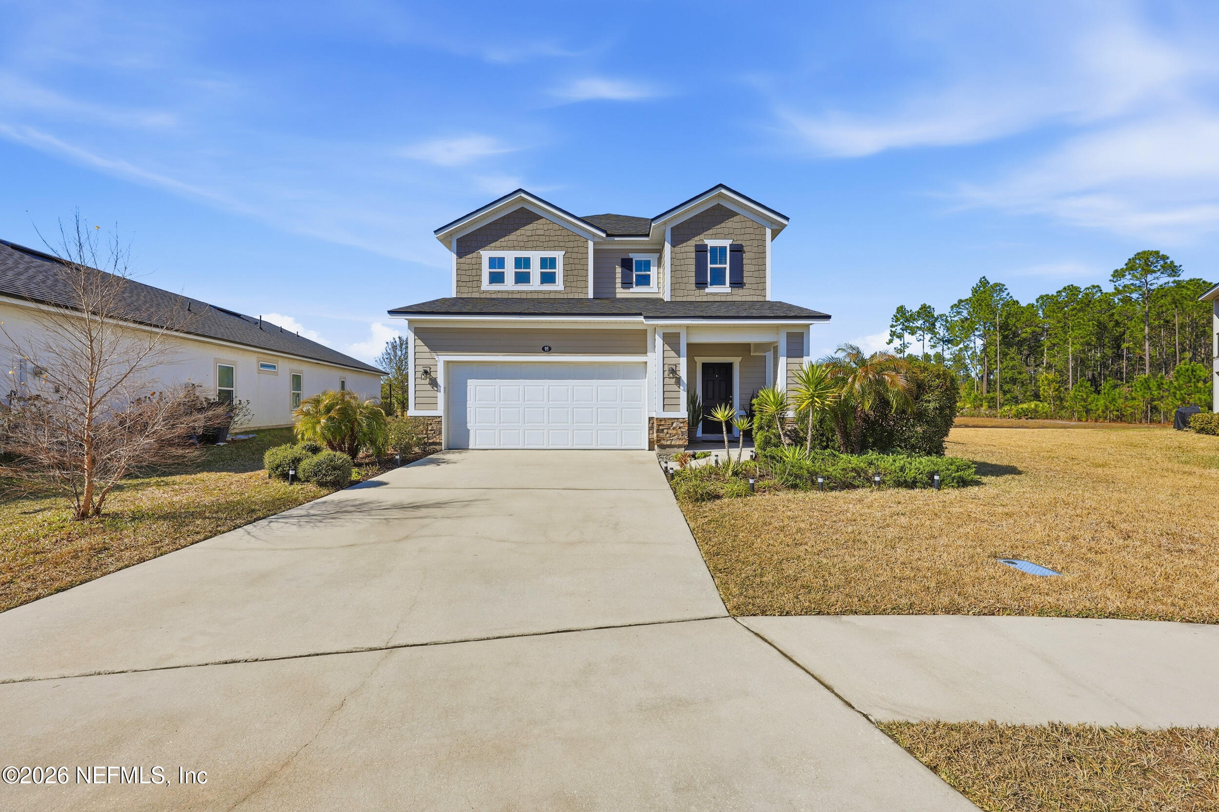 95 Strobe Court St. Augustine, FL 32095 - Photo 41 of 71 a front view of a house with a yard and garage
