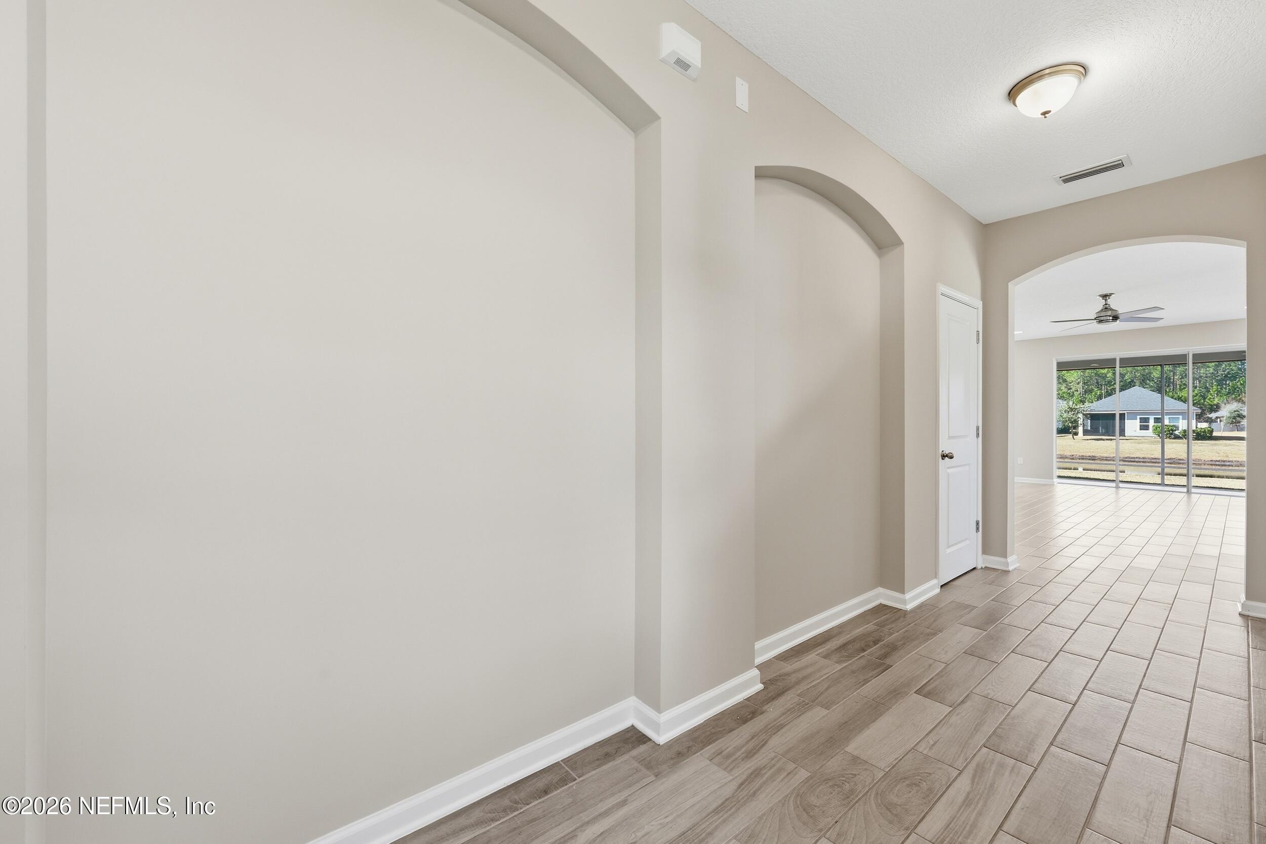 95 Strobe Court St. Augustine, FL 32095 - Photo 5 of 71 a view of a hallway with wooden floor