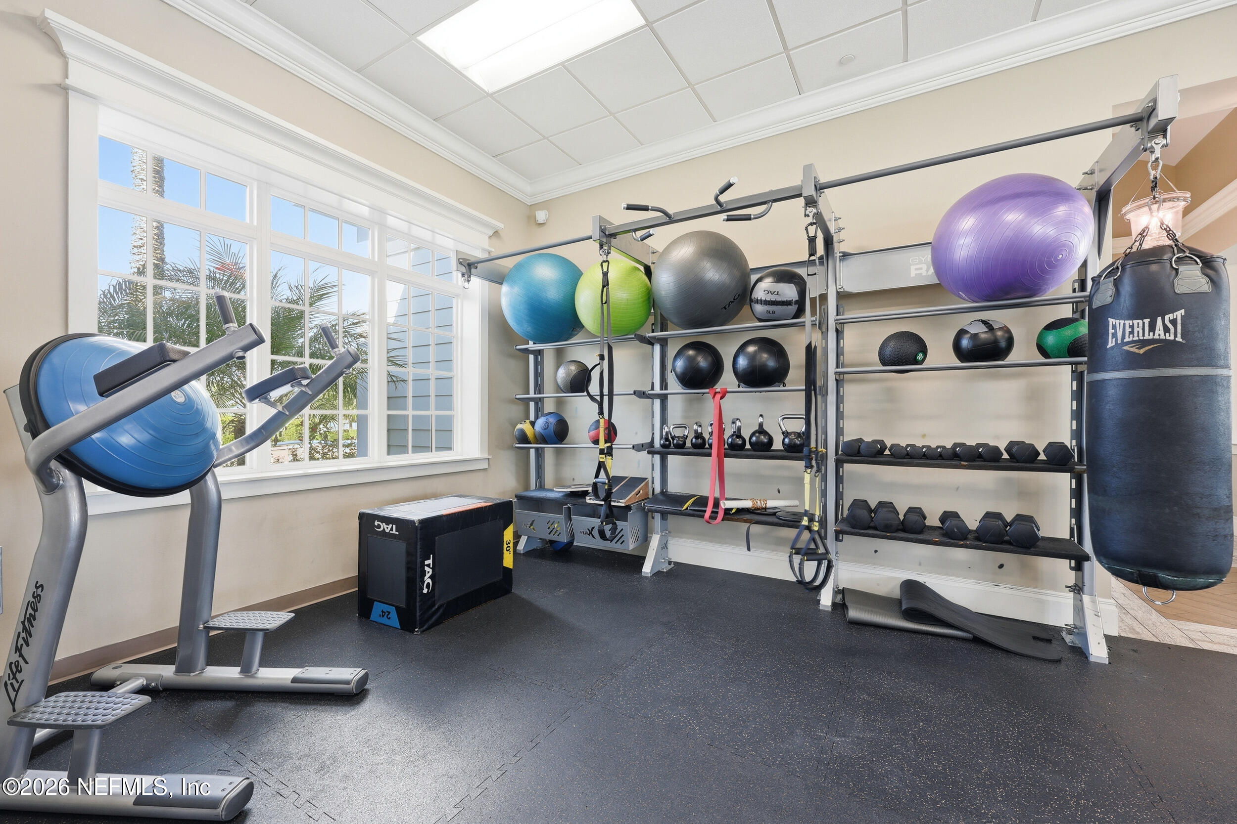 95 Strobe Court St. Augustine, FL 32095 - Photo 57 of 71 a room with gym equipment and a large window