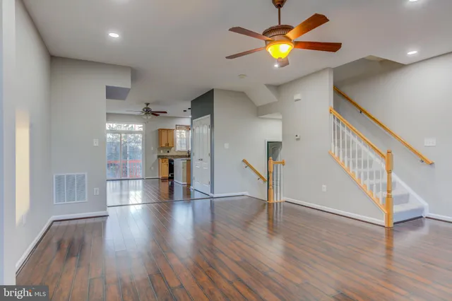 a view of an entryway with wooden floor