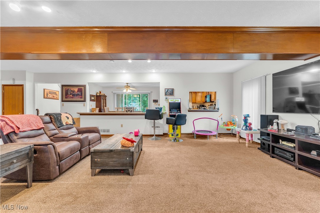 6834 Glendale Road North Ridgeville, OH 44039 - Photo 15 of 37 Living room with carpet flooring and a ceiling fan