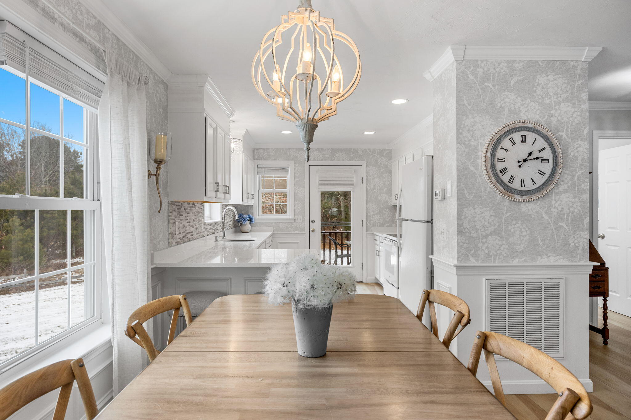 a view of living room kitchen with furniture and wooden floor