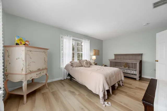 a bed room with a bed and a window