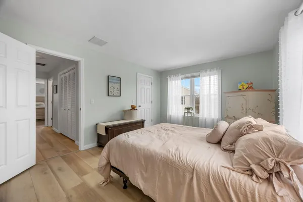 a bedroom with a bed and a couch