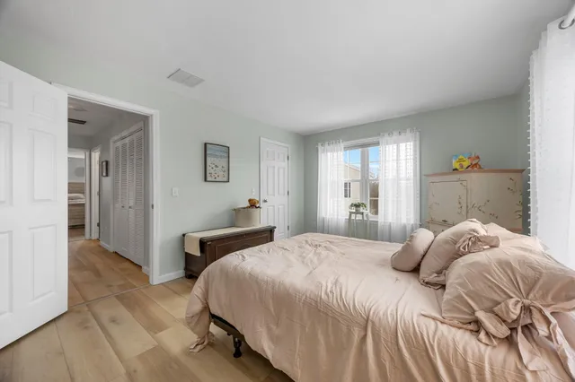 a bedroom with a bed and a couch