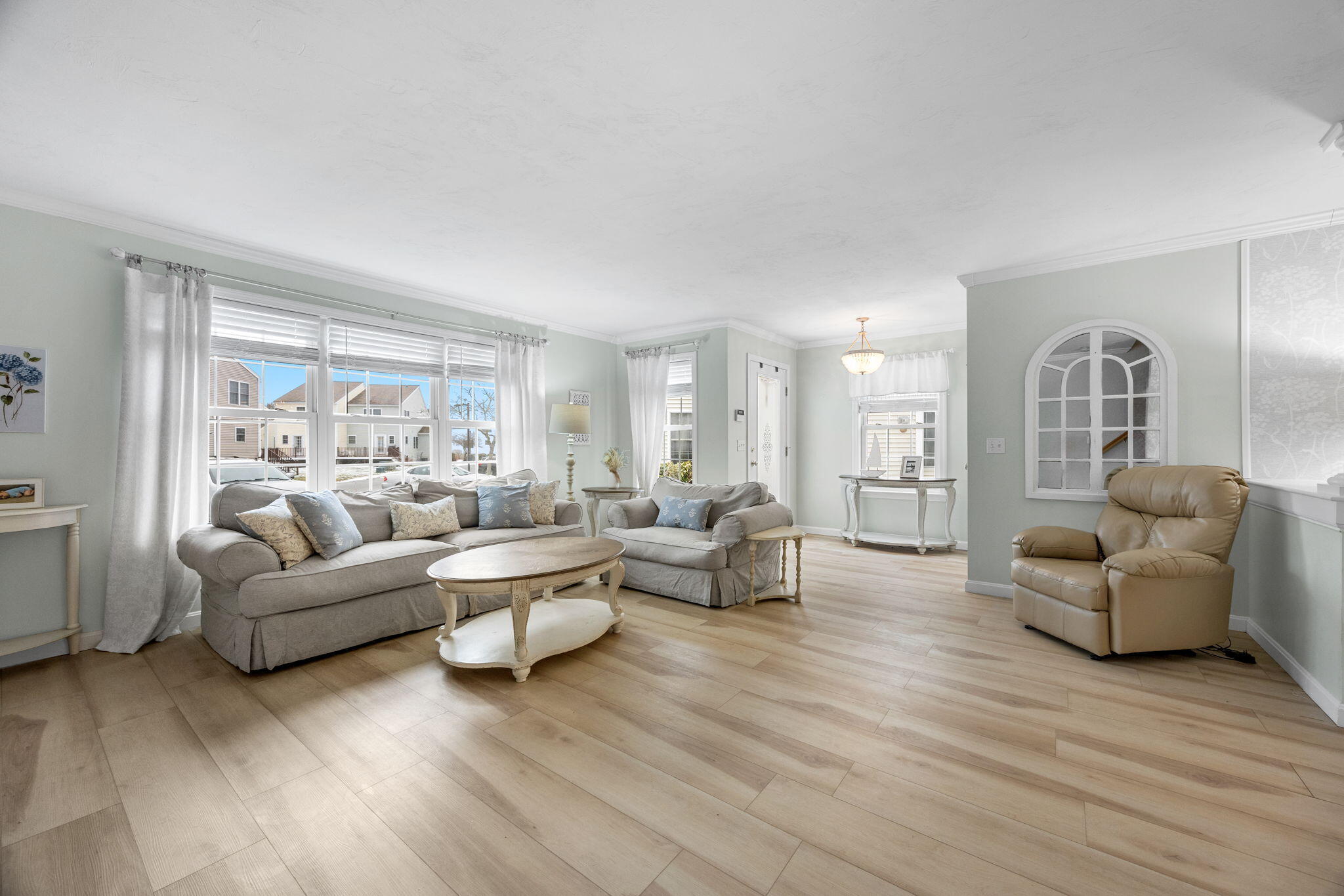 32 Carleton Street, Unit 32 Onset, MA 02558 - Photo 7 of 34 a living room with furniture and a wooden floor
