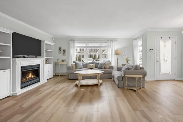 a living room with furniture fireplace and a flat screen tv
