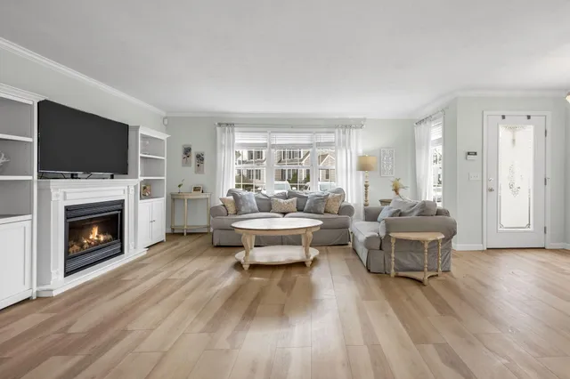 a living room with furniture fireplace and a flat screen tv