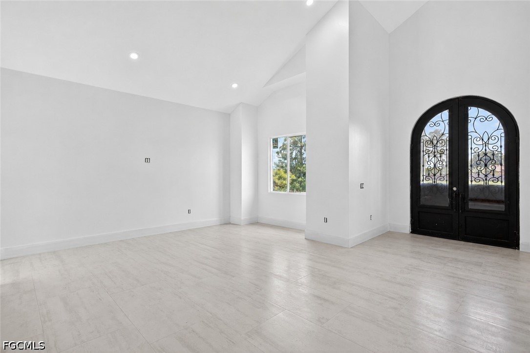 2665 Oil Well Road Naples, FL 34120 - Photo 11 of 40 an empty room with windows