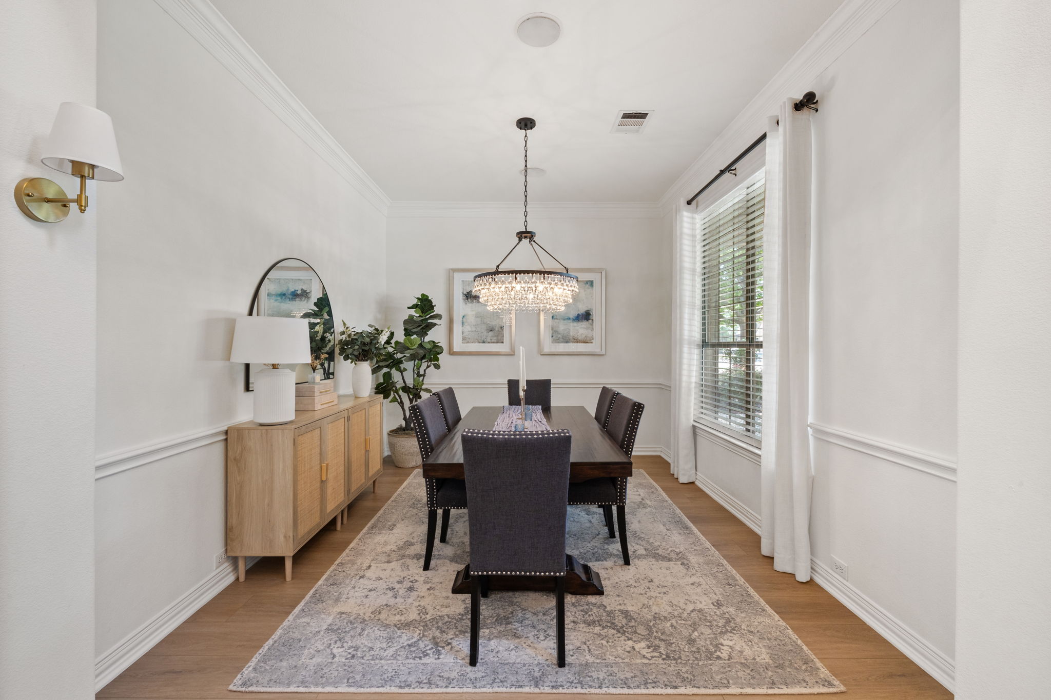 1124 Castle Path Round Rock, TX 78681 - Photo 8 of 40 An inviting dining room features crisp white walls and elegant crown molding, creating an ideal setting for memorable meals.