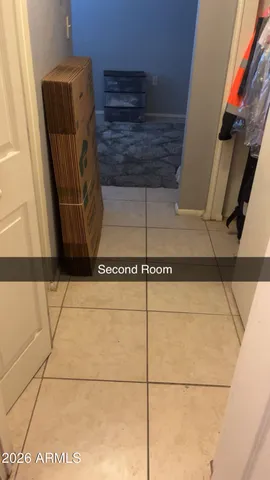 a bathroom with a toilet a sink and a window