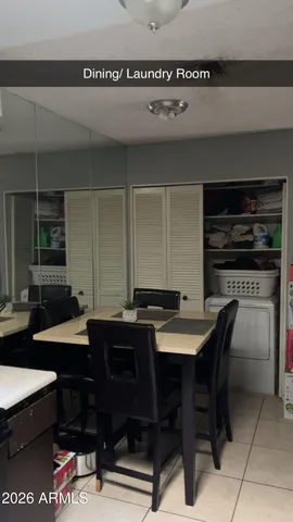 a kitchen with a table and chairs in it