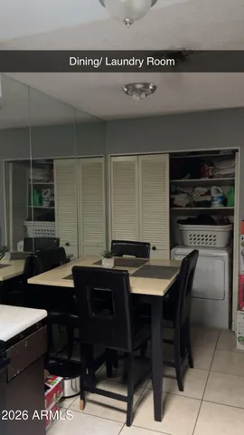 a kitchen with a table and chairs in it