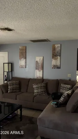 a living room with furniture and a couch