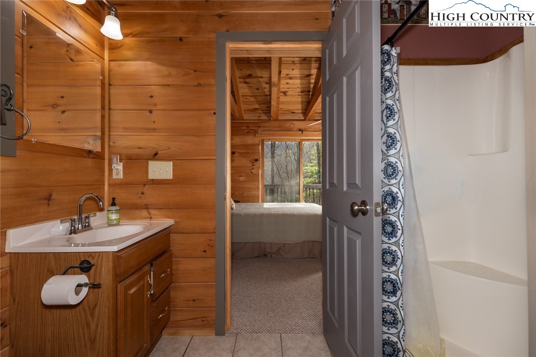 268 Roaring Ridge Road Deep Gap, NC 28618 - Photo 29 of 34 a bathroom with a sink and a mirror