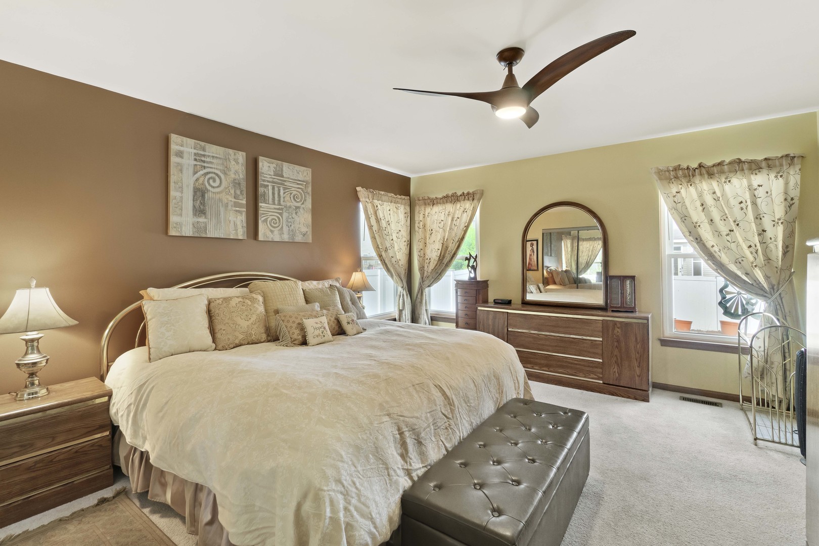 374 Fox Bend Circle Bolingbrook, IL 60440 - Photo 14 of 32 a bedroom with a bed and a dresser with mirror