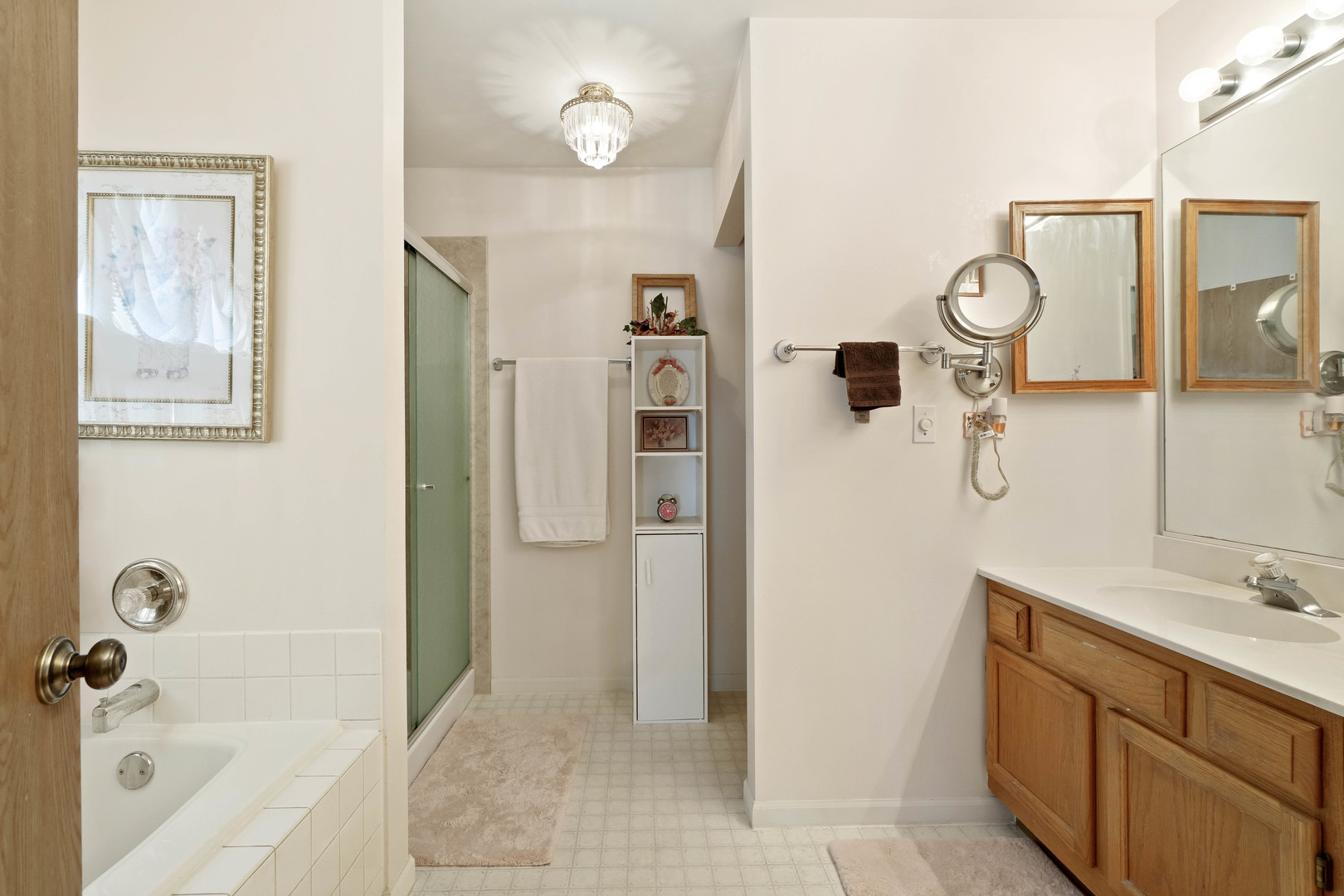 374 Fox Bend Circle Bolingbrook, IL 60440 - Photo 16 of 32 a bathroom with a tub sink and mirror