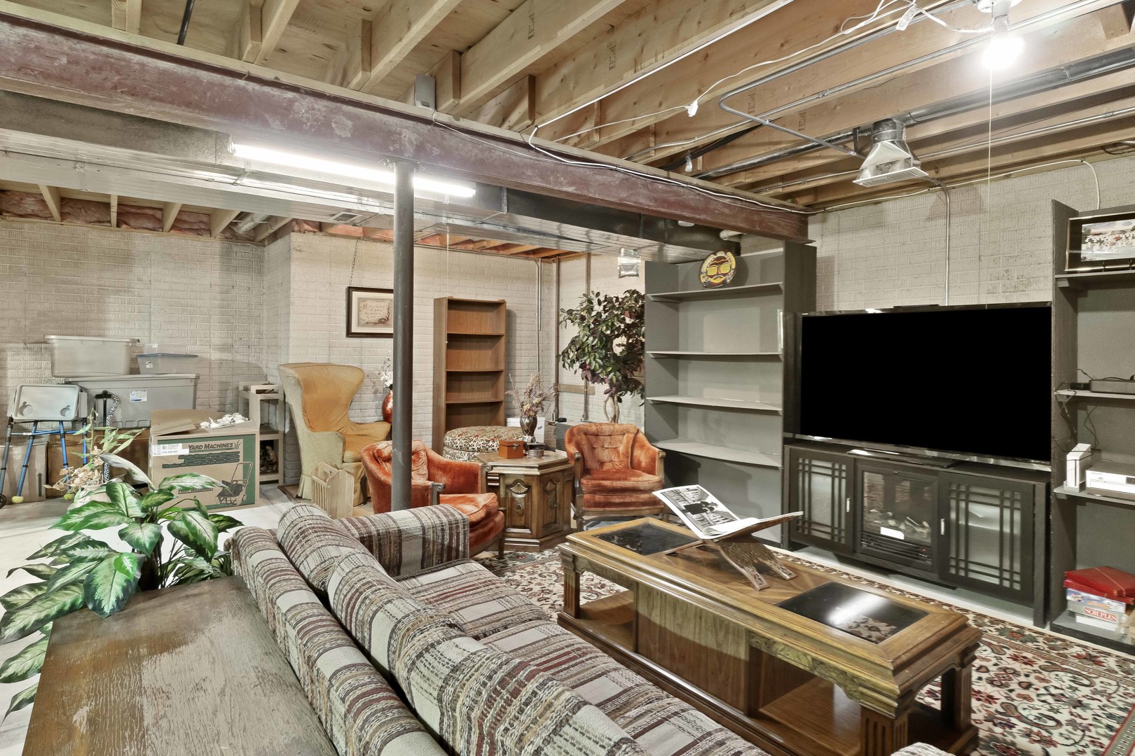 374 Fox Bend Circle Bolingbrook, IL 60440 - Photo 23 of 32 a living room with furniture and a flat screen tv