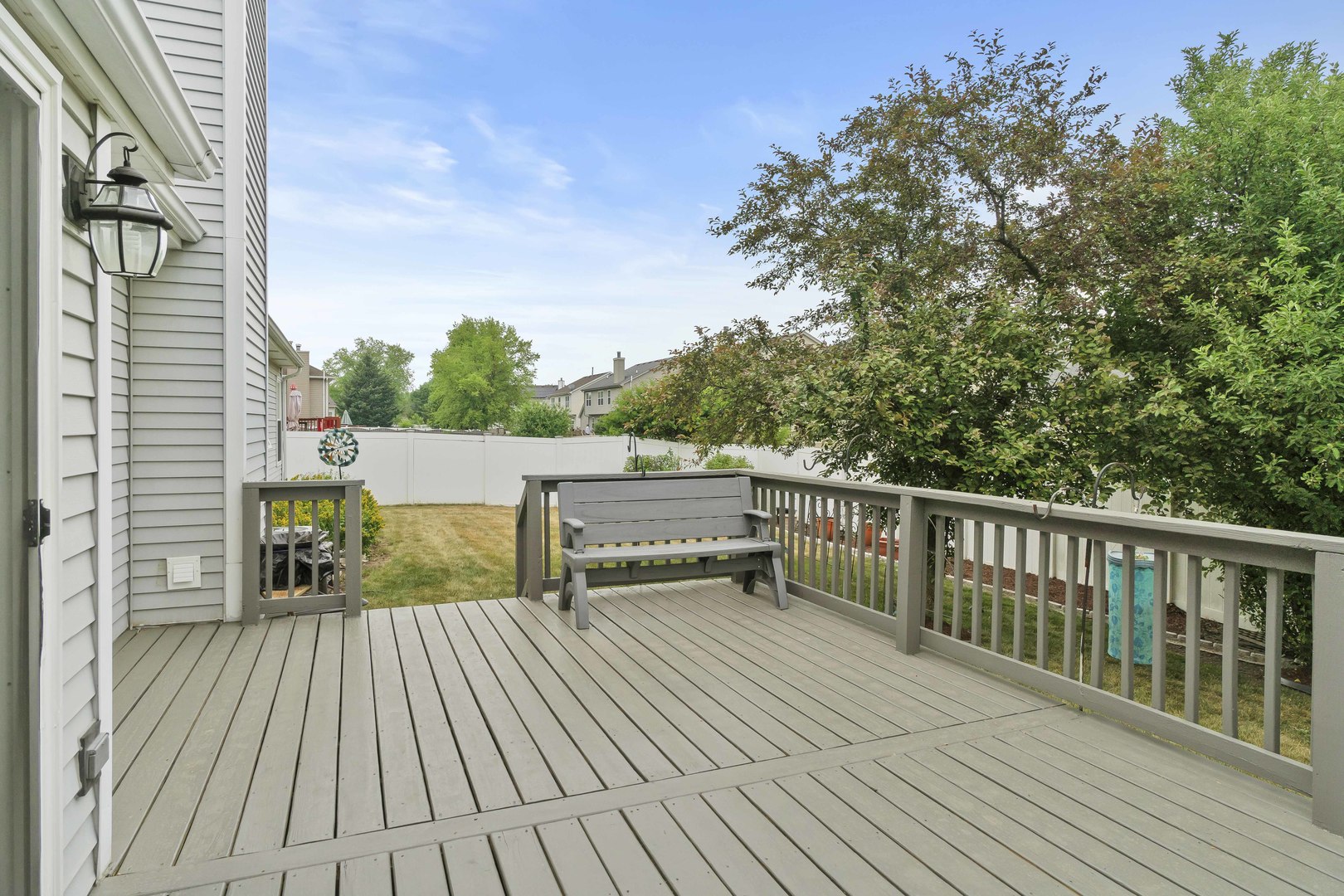 374 Fox Bend Circle Bolingbrook, IL 60440 - Photo 25 of 32 a balcony with wooden floor and outdoor seating