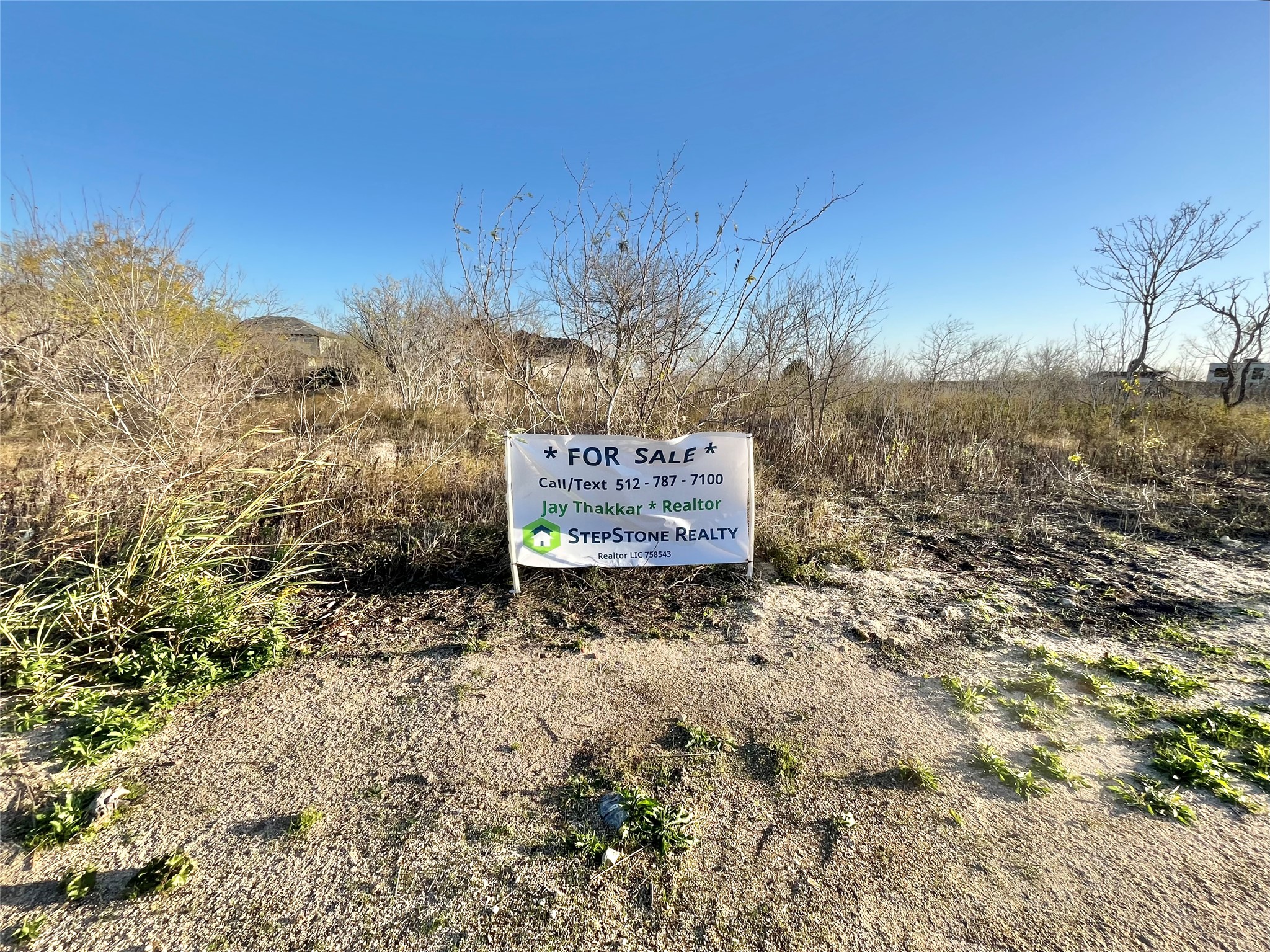 390 Engelke Road Niederwald, TX 78640 - Photo 3 of 10 a sign board with tall trees