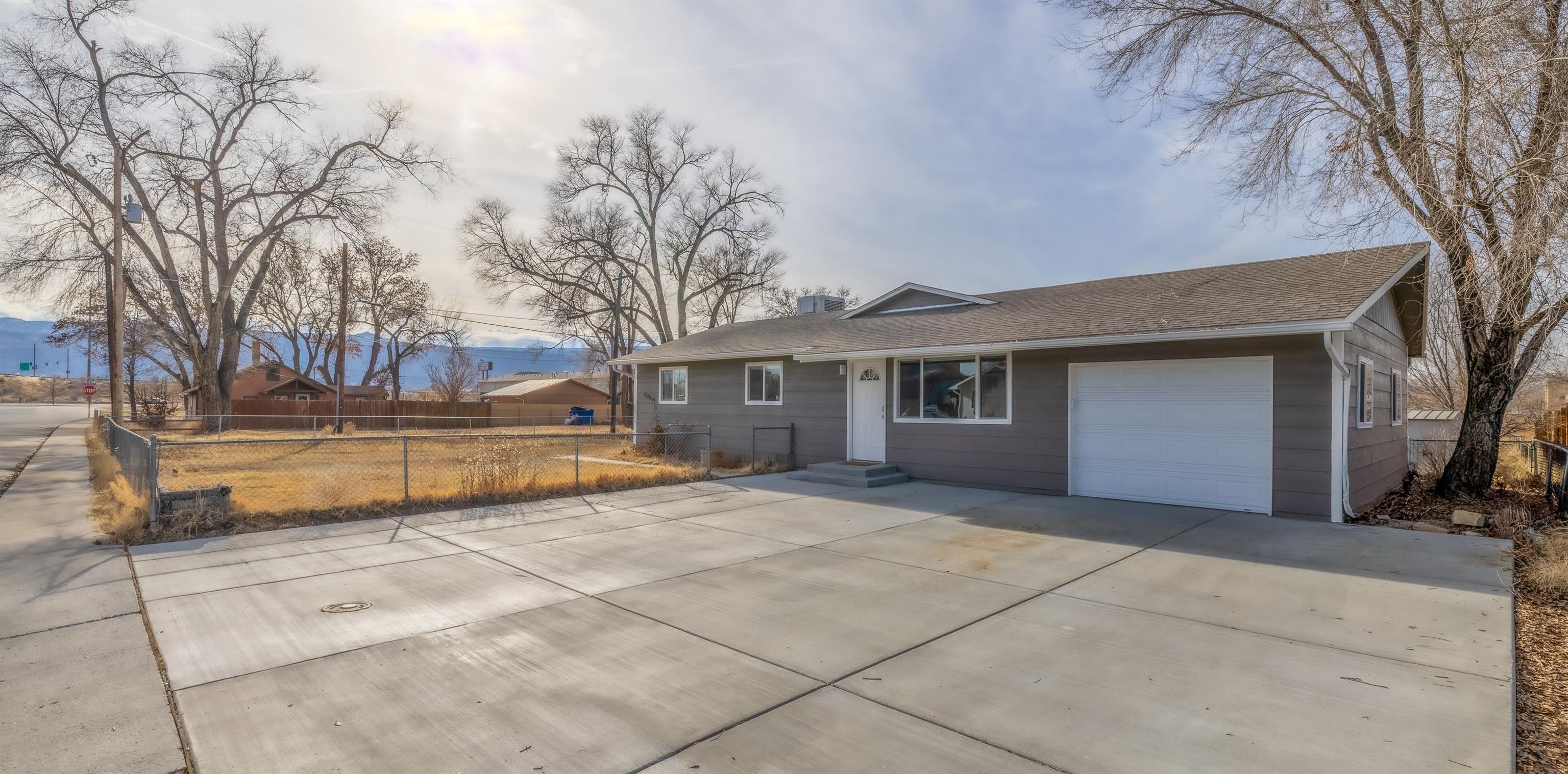 137 North Willow Street Fruita, CO 81521 - Photo 1 of 27 a view of a house with a snow and yard