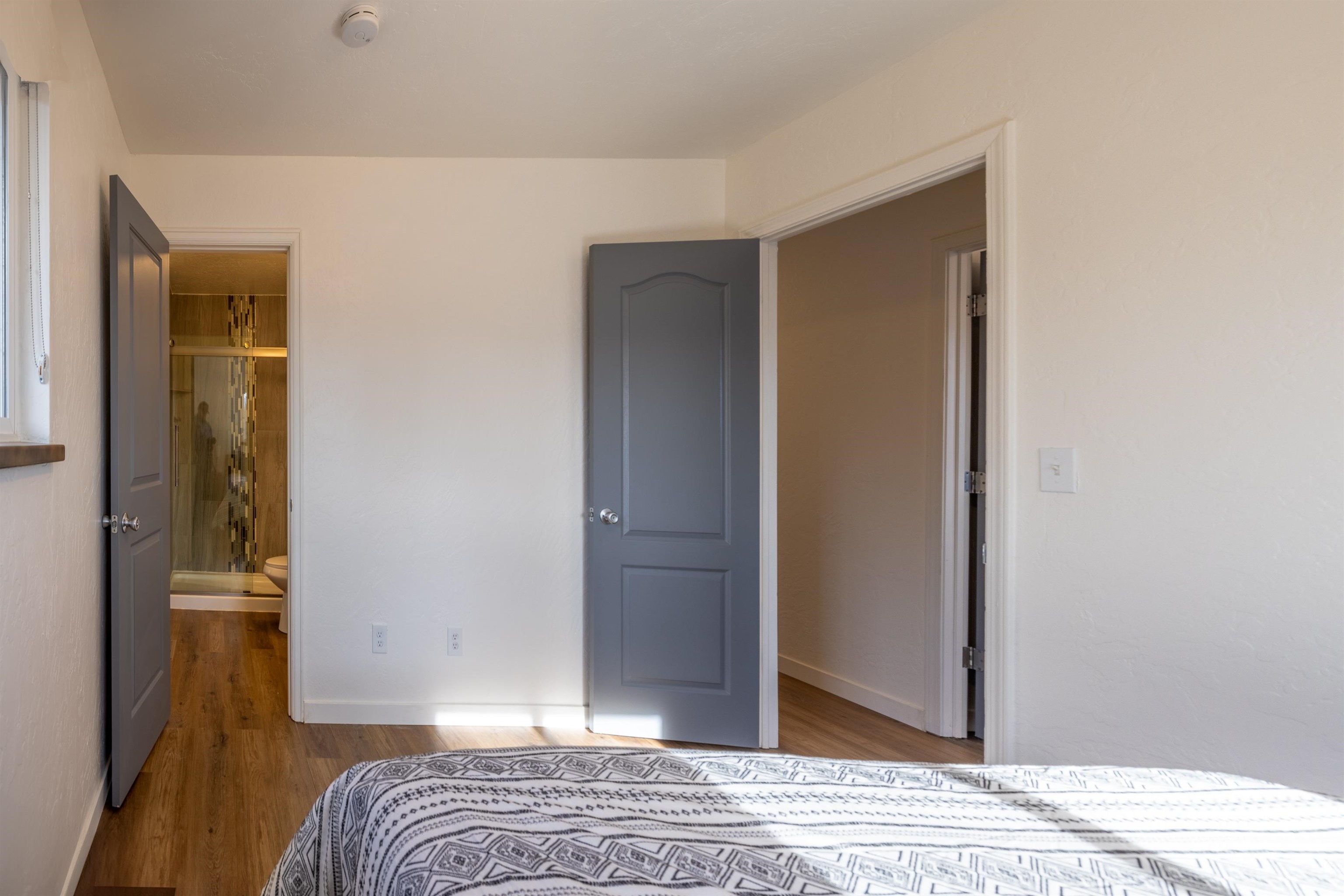137 North Willow Street Fruita, CO 81521 - Photo 11 of 27 a bedroom with a bed and a mirror