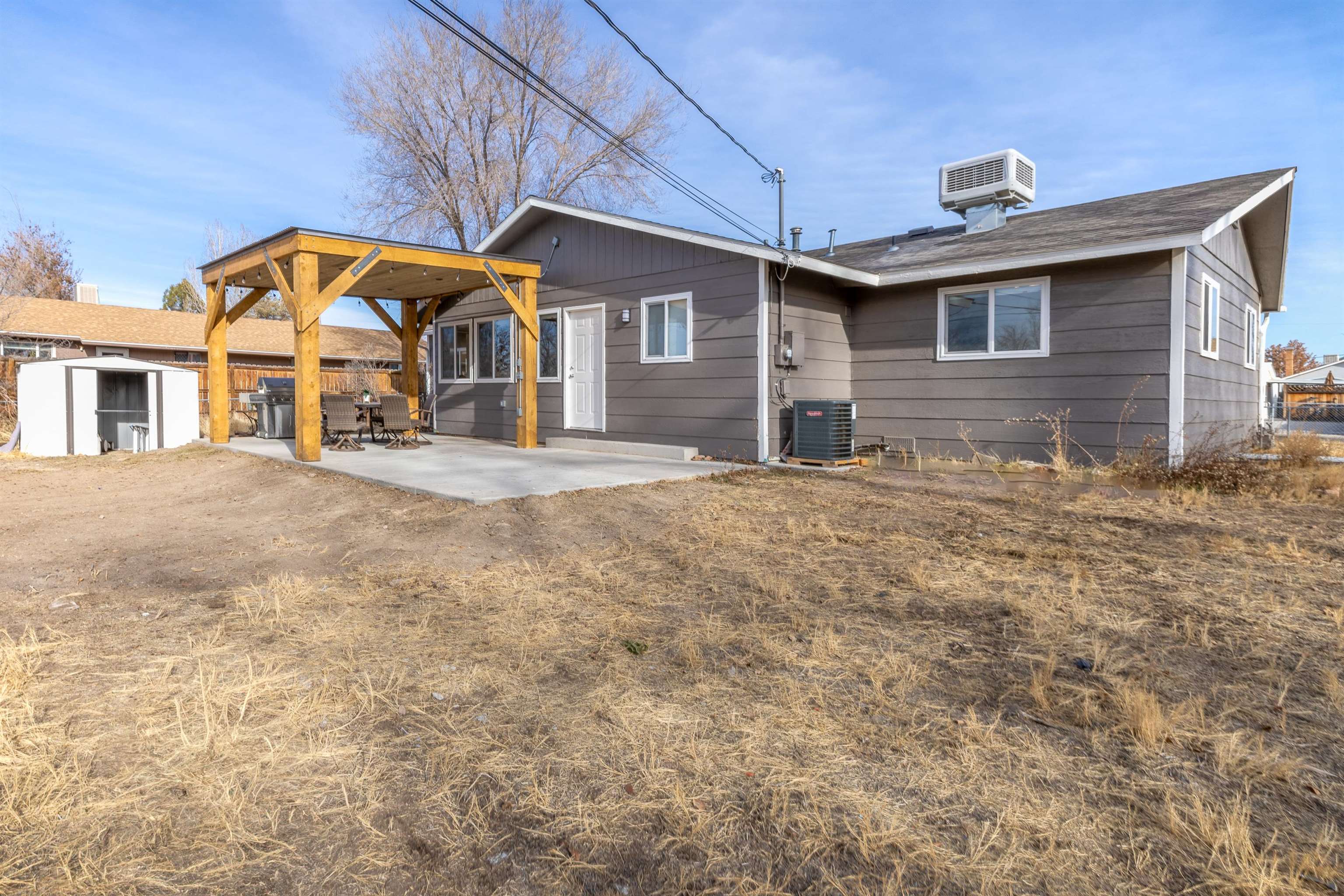 137 North Willow Street Fruita, CO 81521 - Photo 23 of 27 a front view of a house with a yard